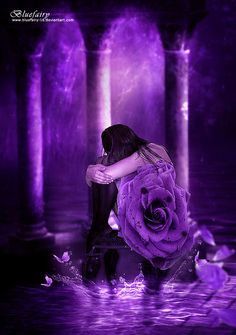 a woman is sitting in the water with a rose on her lap and purple lights behind her