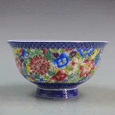 a blue and white bowl with flowers on it