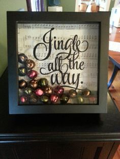 a framed art piece with the words jingle all the way