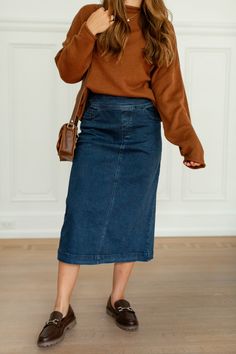 Add a little flair and contrast to your outfit with the 'Margaret' denim mid skirt! This midi skirt features stretch denim and a flattering silhouette for a comfortable fit all day. Pair with a fitted top and white sneakers for a fun and casual ensemble for a day out at the park! Exclusively designed by us with you in mind. 97% Cotton, 3% Spandex Hand Wash Cold Hang or Lay Flat to Dry Iron Low Heat Do Not Bleach Do Not Dry Clean Functional front & back pockets! Slight flared/A-Line Style Model H Midi Denim Skirt Outfit Fall, Midi Skirt Outfit, Mid Skirt, Layered Tops, Fitted Top, Denim Midi Skirt, Skirt Outfit, Skirt Leggings, Fall 2024