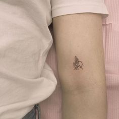 a person with a small tattoo on their arm