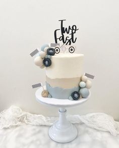 there is a cake that has been decorated with blue and white decorations on the top