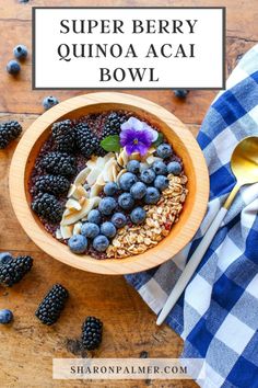 a bowl filled with fruit and cereal on top of a wooden table