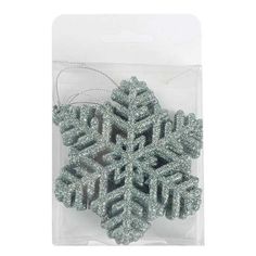 a snowflake ornament in a package