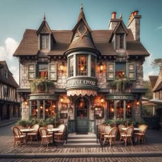 the outside of a restaurant with tables and chairs in front of it on a cobblestone street