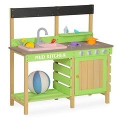 a green wooden play kitchen with sink and stove