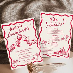 two red and white wedding cards sitting on top of a table next to each other