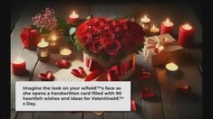 red roses in a heart - shaped box with candles around it on a wooden table