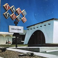 an old photo of a taco restaurant with the name welcome on it's sign