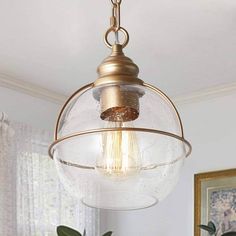 a light fixture hanging from the ceiling in a room