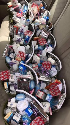 several baskets filled with toiletries in the back seat of a car