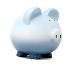 a white and blue piggy bank sitting on top of a table