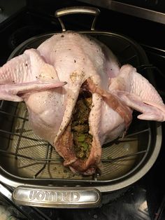 a whole chicken sitting on top of an oven rack