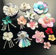 several different types of hair clips on a black background with the words ebay written below it