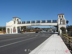 an empty street with a bridge over it