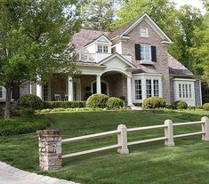 a house with a white picket fence in front of it