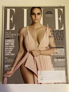 a magazine with a woman in a pink dress on the cover