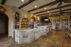 the inside of a restaurant with stone counter tops