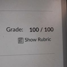 a sign that says grade 100 / 100 show rubric