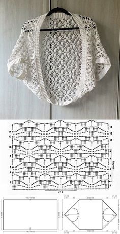 a white crocheted sweater hanging on a wall next to a piece of paper