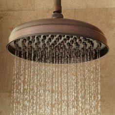 a shower head with water flowing from it