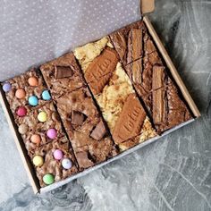 a box filled with brownies covered in candy