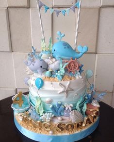 a blue and white cake with sea animals on it