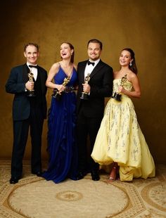 three men and two women in formal wear holding their oscars for the best actress