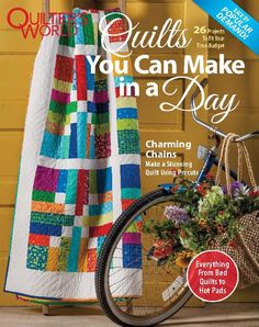 the cover of quilts you can make in a day magazine, featuring a bicycle