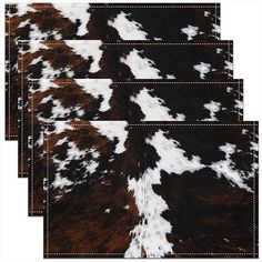 four brown and white cowhide rugs with stitching on the bottom one side