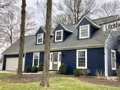 a blue house with a sign that says lithgton on it's front