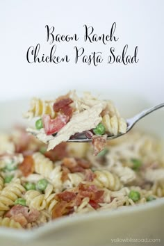 bacon ranch chicken pasta salad in a white bowl with a ladle full of it