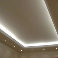 a room with a ceiling that has lights on it