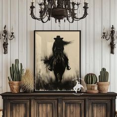 a black and white photo of a cowboy on a horse in the middle of a room