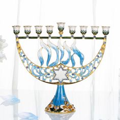 a blue and gold menorah with five candles