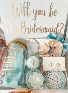 the bridesmaid gift box is filled with personalized items