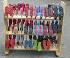 there are many pairs of slippers on display in the store's shoe rack