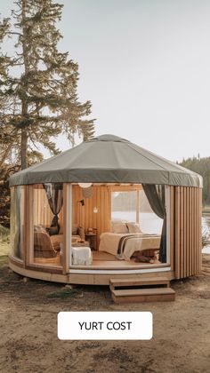 a tent with the words yurt cost on it and an image of a bed inside