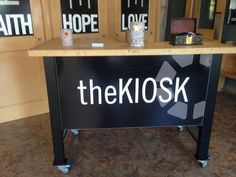 there is a sign that says the kolosk on it in front of other signs