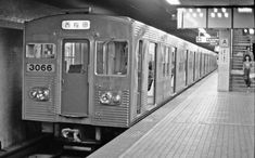 a subway train is stopped at the station