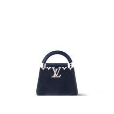 Inspired by starry night skies, the capucines mini flower crown handbag is made from rich, deep-blue velvet ornamented with decorative monogram flowers, each one hand-set with sparkling crystals. A braided chain strap can be attached to the piece for shoulder or cross-body wear. A sublime accessory, designed for the most enchanted evenings. Louis Vuitton Capucines Mini, Capucines Mini, Louis Vuitton Mini, Louis Vuitton Shoulder Bag, Velvet Bag