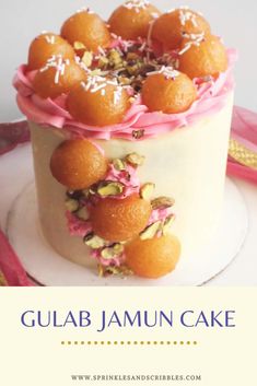 gulab jamun cake with pink icing and sprinkles on top