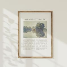 a painting hanging on the wall next to a wooden frame with an article about how great thou art