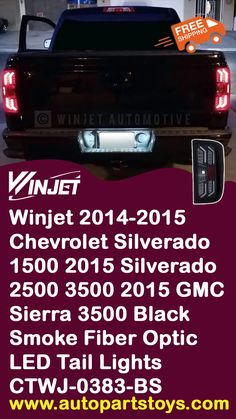 the back end of a black truck with its lights on and an advertisement for winter 2012 - 2013 chevrolet silverado 3500