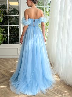 Teuta Matoshi Blue Dress, Off-shoulder Tulle Ball Gown For Banquet, Off-shoulder Fitted Bodice Evening Dress For Debutante Ball, Fitted Off-shoulder Evening Dress For Debutante Ball, Light Blue Tulle Gown For Gala, Off-shoulder Tulle Ball Gown With Fitted Bodice, Off-shoulder Tulle Gown With Fitted Bodice, Blue Tulle Gown With Corset Back, Light Blue Strapless Evening Dress For Wedding