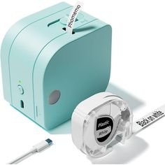 an image of a blue box with some tape and scissors next to it on a white background