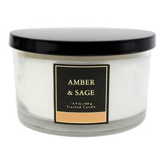 an amber and sage candle with black lid