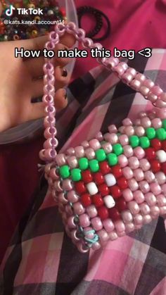 someone is holding a beaded purse in their hand