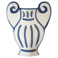 a blue and white vase with swirls on the top is sitting in front of a white background