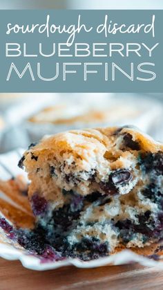 blueberry muffins on a white plate with text overlay that reads sourdough discard blueberry muffins